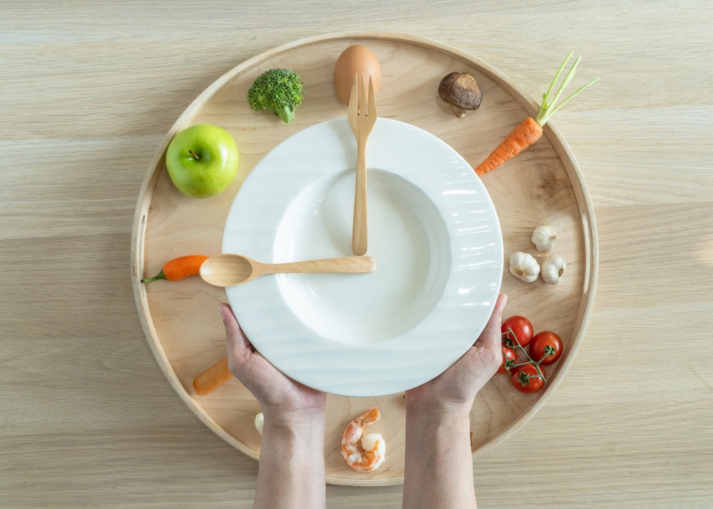 Plate with spoons arranged like clock hands