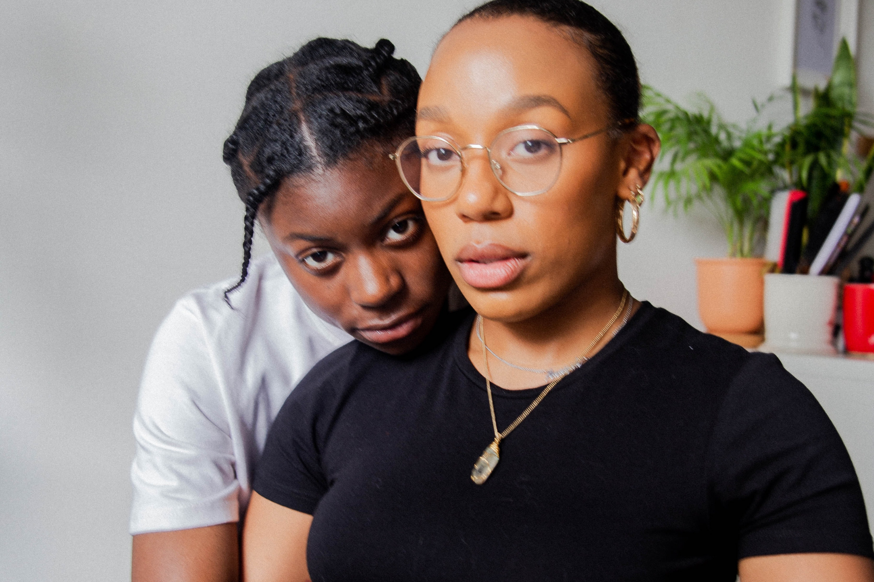 Why language is important to queer people with PCOS – two people hugging and looking at camera