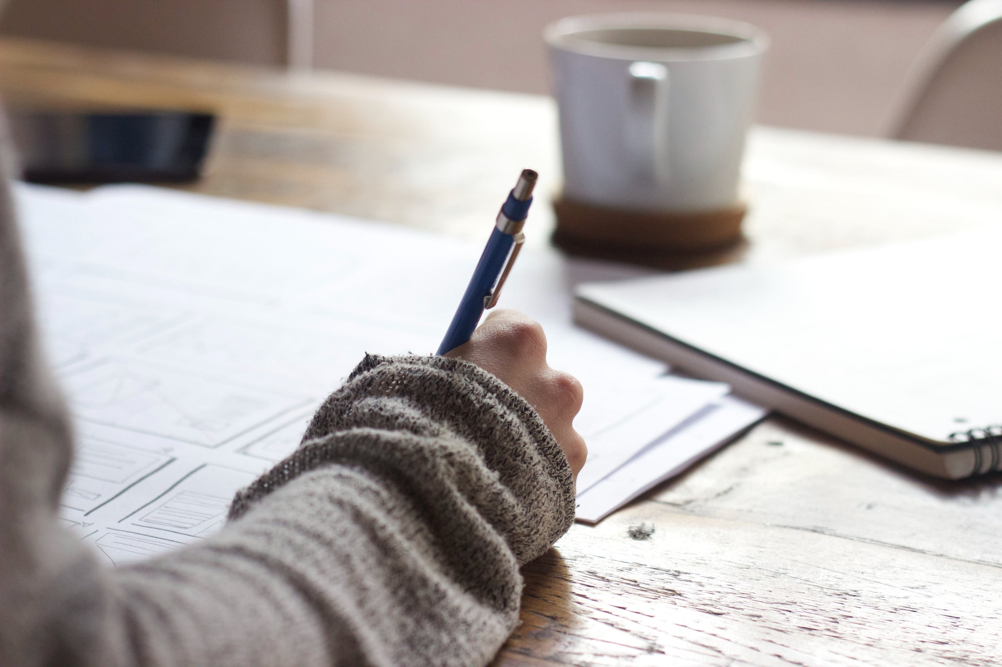 Calm anxiety naturally: person writing in notebook