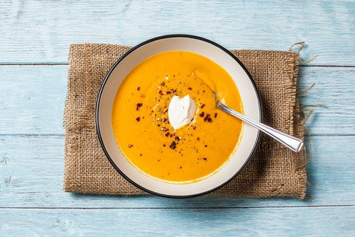 Overhead photo of butternut squash soup in a bowl