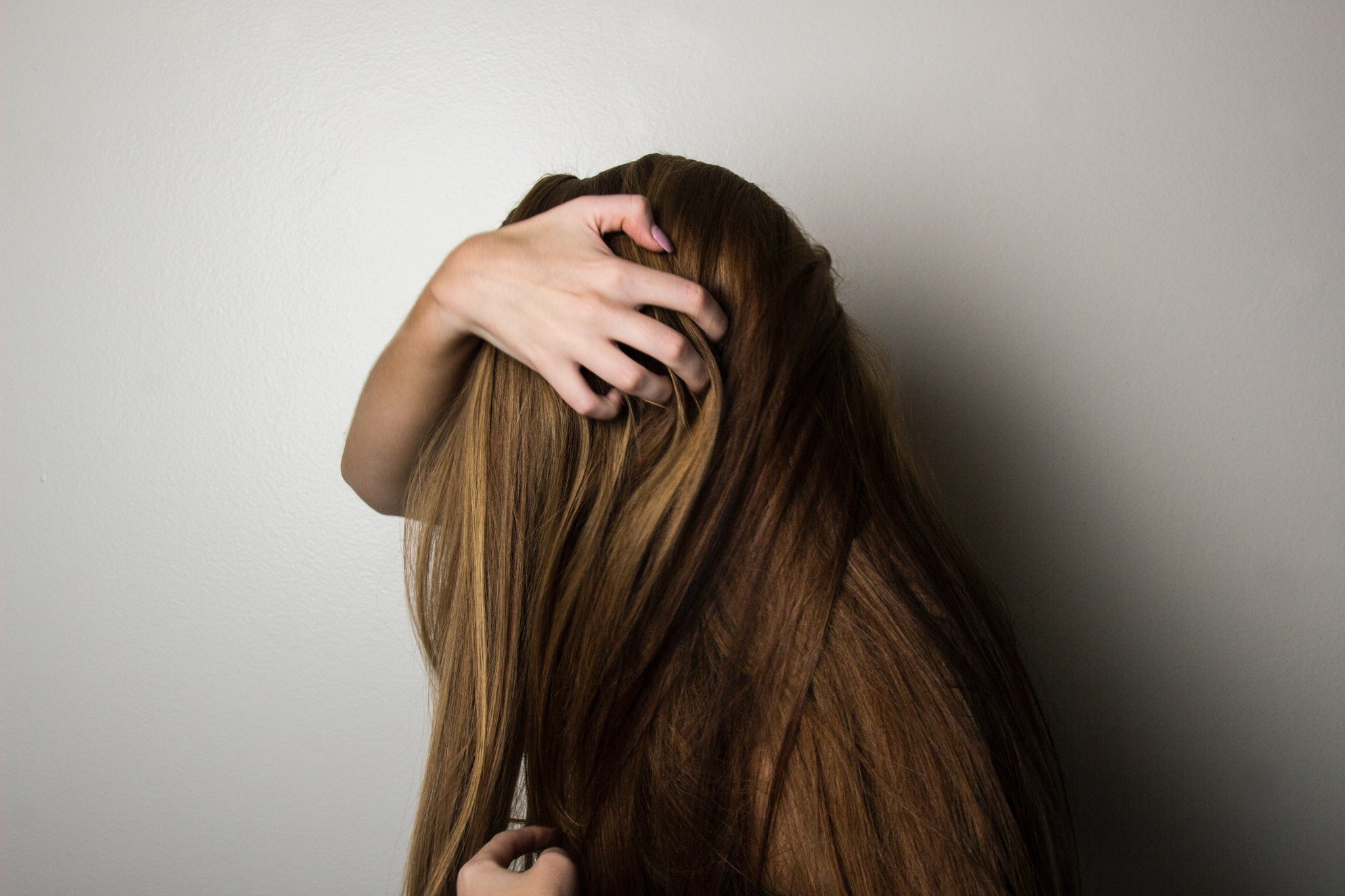 women holding her long hair