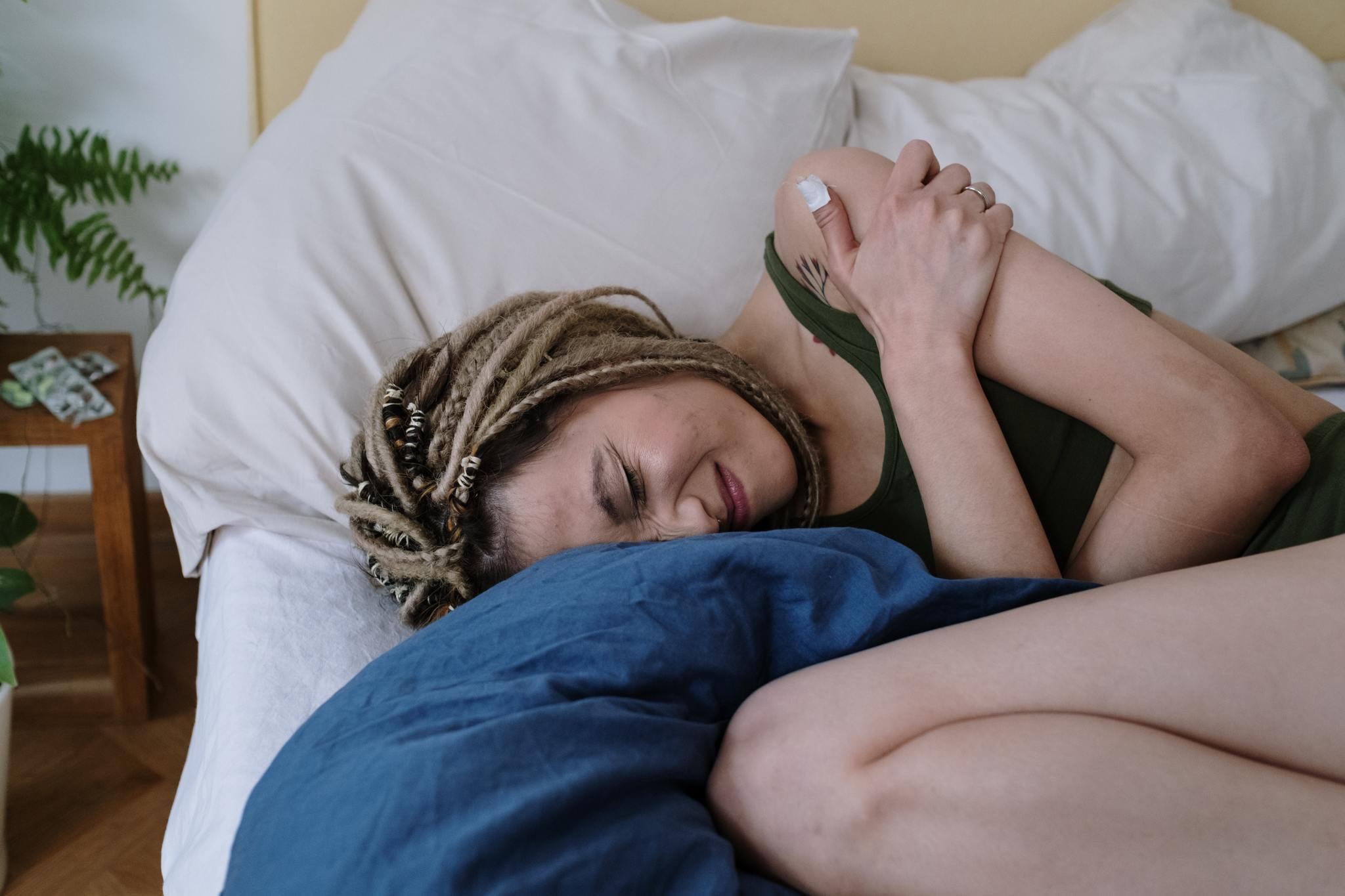 woman in bed with inflammation